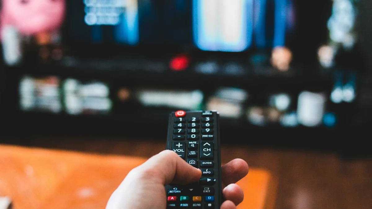 British homeowner relaxing on a sofa holding a TV remote control watching live sports with a UK IPTV subscription
